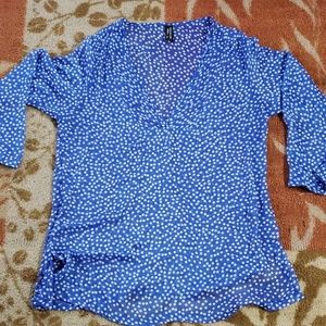 Lightweight blue tunic with white polka dots.
